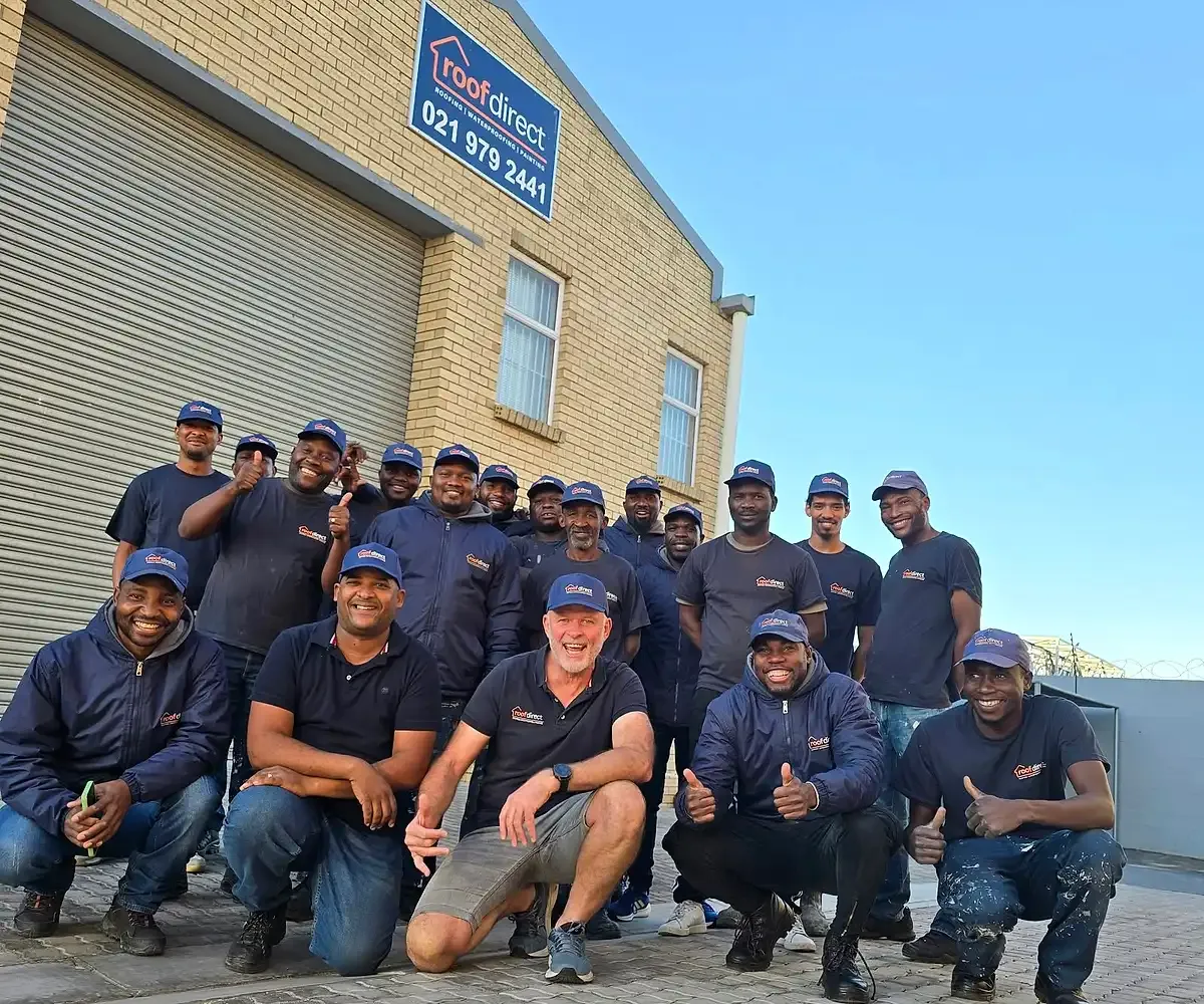 Andre Smit (centre, front row), with foreman Randall Swarts beside him, and the Roof Direct team outside the Roof Direct workshop